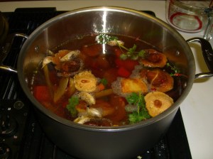Roasted vegetable stock, simmering